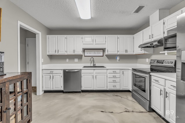 23214 Rochelle Loop, Robertsdale, AL 36567 - kitchen with stainless steel appliances, under cabinet range hood, white cabinetry, light countertops, and a textured ceiling