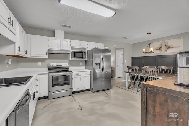 23214 Rochelle Loop, Robertsdale, AL 36567 - kitchen with appliances with stainless steel finishes, under cabinet range hood, concrete floors, light countertops, and white cabinets