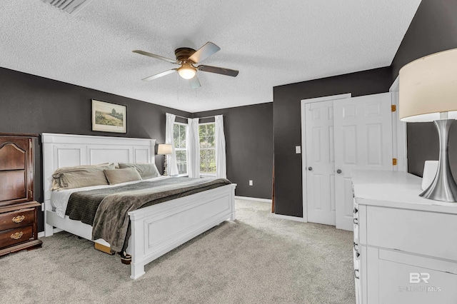 23214 Rochelle Loop, Robertsdale, AL 36567 - bedroom featuring a textured ceiling, light colored carpet, ceiling fan, and a closet