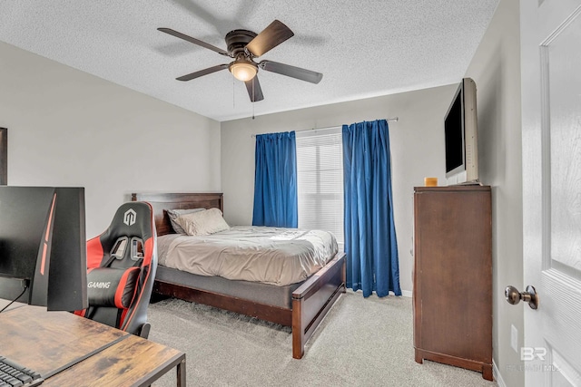 23214 Rochelle Loop, Robertsdale, AL 36567 - bedroom with carpet, a textured ceiling, and a ceiling fan