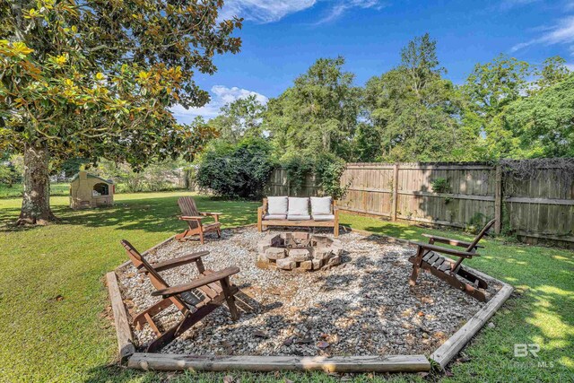23214 Rochelle Loop, Robertsdale, AL 36567 - view of yard with a fire pit