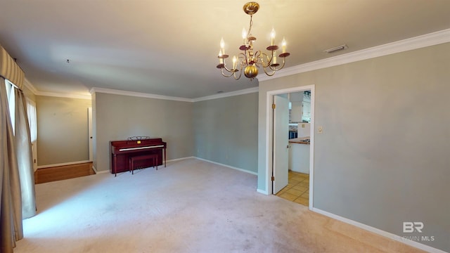 carpeted spare room with baseboards, ornamental molding, visible vents, and a notable chandelier