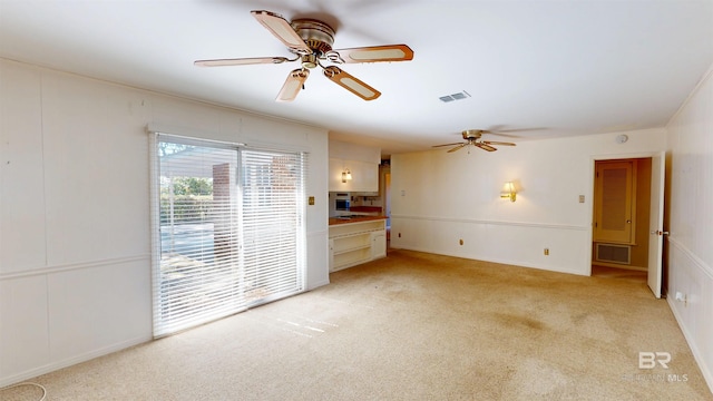 unfurnished bedroom with access to exterior, light colored carpet, visible vents, and ceiling fan