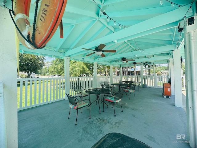 view of patio with ceiling fan and outdoor dining area