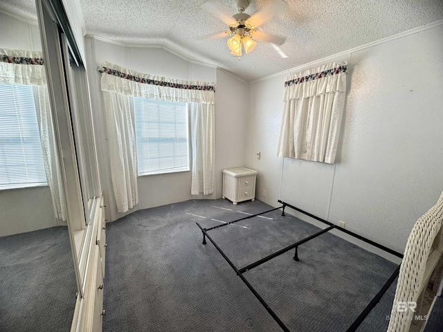 unfurnished bedroom featuring ornamental molding, multiple windows, and a textured ceiling