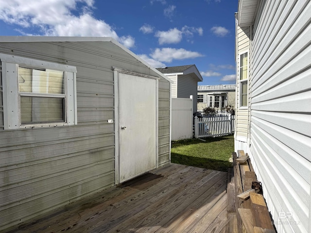 view of shed featuring fence