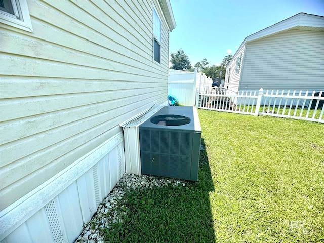 exterior details with fence and cooling unit