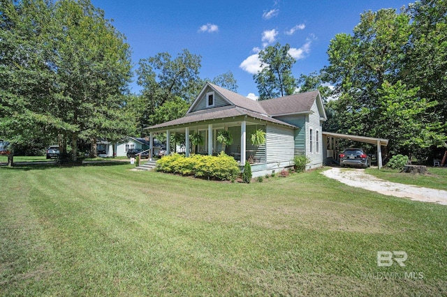 view of side of home with a carport, a porch, and a lawn