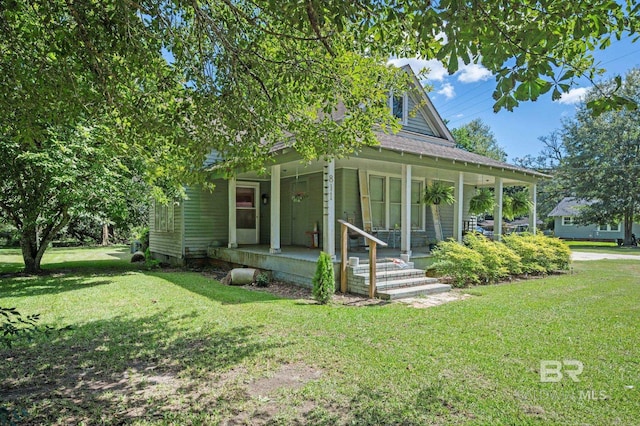 view of front of house with a porch and a front yard