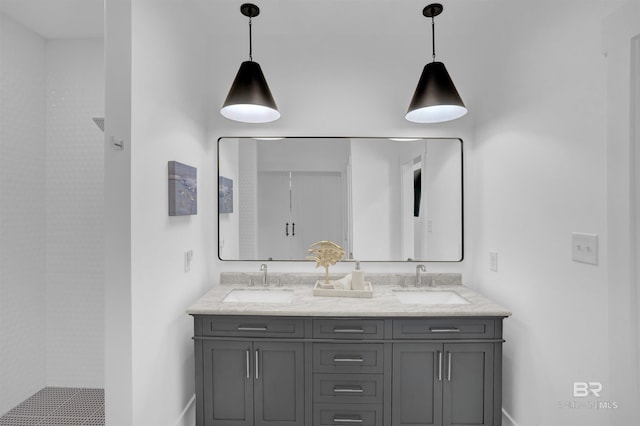 full bathroom with double vanity and a sink