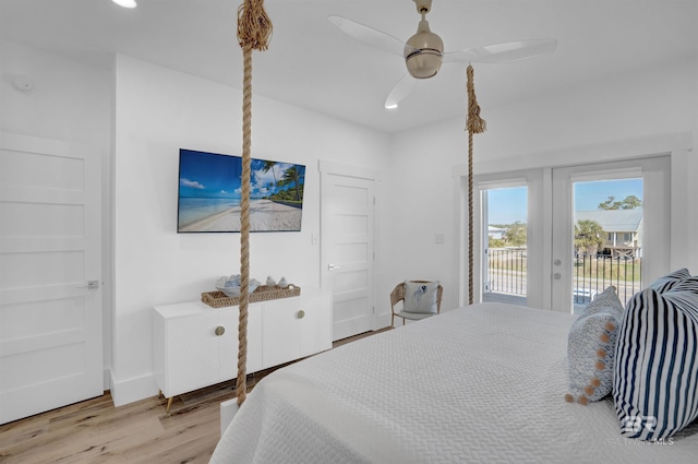 bedroom with baseboards, recessed lighting, french doors, wood finished floors, and access to outside