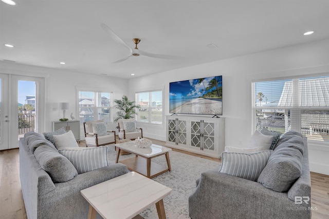 living area with recessed lighting, wood finished floors, and ceiling fan