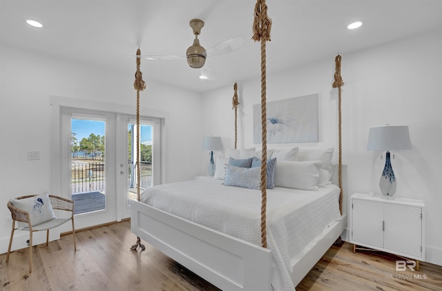 bedroom with recessed lighting, french doors, wood finished floors, and access to outside