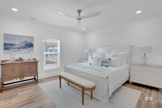 bedroom featuring recessed lighting, visible vents, wood finished floors, and a ceiling fan