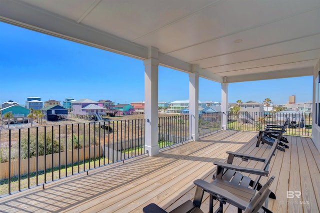 wooden deck with a residential view