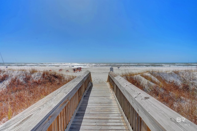 view of home's community with a view of the beach and a water view