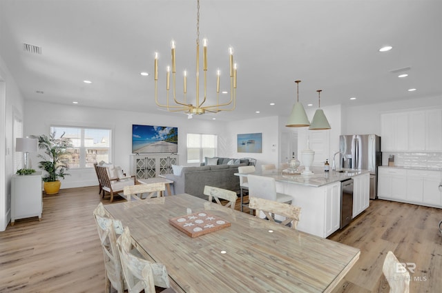 dining area featuring a wealth of natural light, visible vents, recessed lighting, and light wood-type flooring