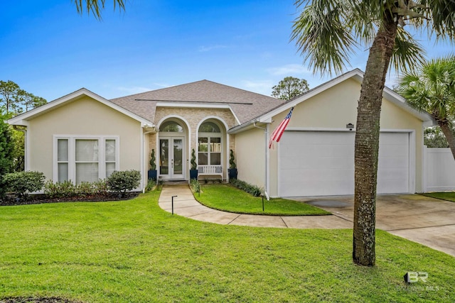 view of front of home with a shingled roof, a front yard, french doors, and stucco siding