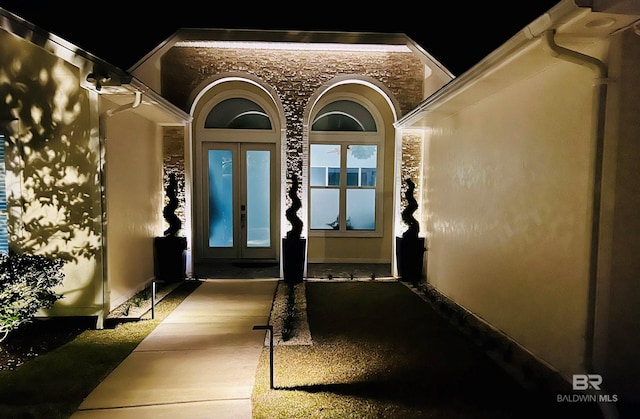 property entrance featuring french doors