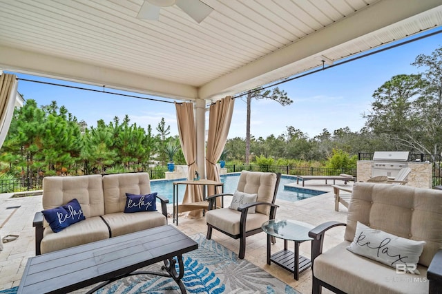 view of patio / terrace with a fenced in pool, a fenced backyard, grilling area, exterior kitchen, and outdoor lounge area