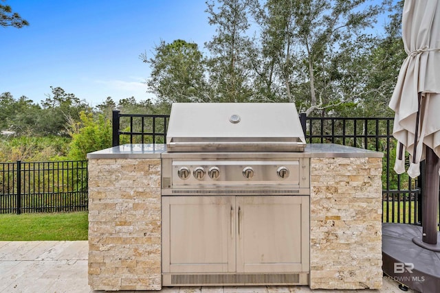 view of patio / terrace featuring fence and area for grilling