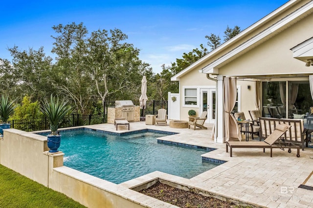 view of swimming pool featuring a fenced in pool, french doors, a patio area, and a fenced backyard