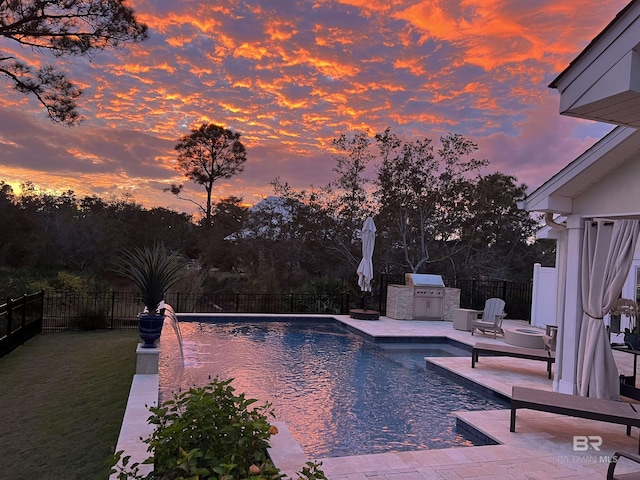 view of swimming pool with a patio, area for grilling, a fenced backyard, and a fenced in pool