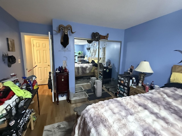 bedroom with wood finished floors