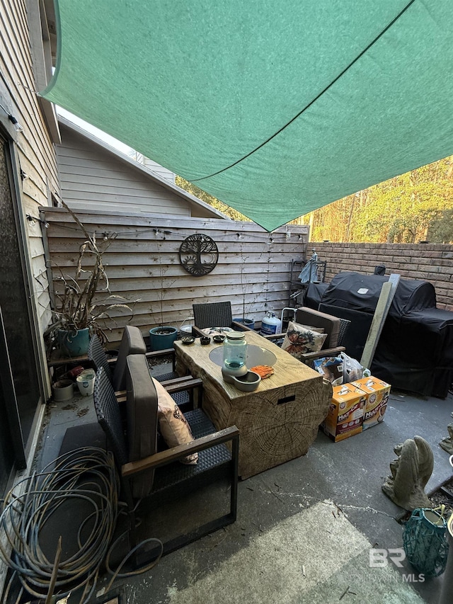 view of patio featuring fence