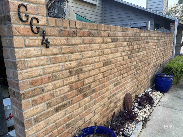 exterior space with brick siding