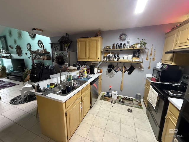 kitchen with light tile patterned floors, a peninsula, a sink, light countertops, and appliances with stainless steel finishes