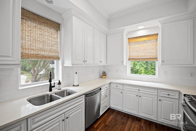4672 Grander Ct Unit 15B, Orange Beach, AL 36561 - kitchen featuring stainless steel appliances, a sink, crown molding, white cabinetry, and decorative backsplash