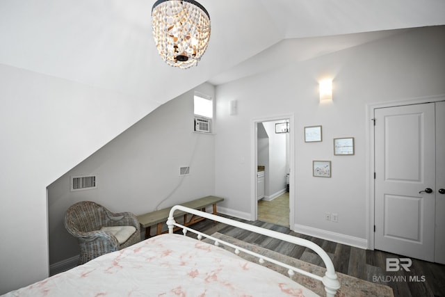 4672 Grander Ct Unit 15B, Orange Beach, AL 36561 - bedroom with wood finished floors, vaulted ceiling, a chandelier, and baseboards