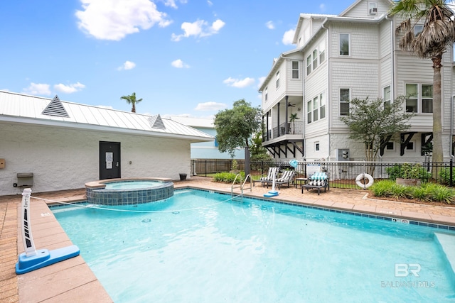 4672 Grander Ct Unit 15B, Orange Beach, AL 36561 - view of pool featuring fence and a pool with connected hot tub