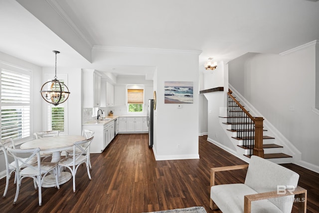 4672 Grander Ct Unit 15B, Orange Beach, AL 36561 - kitchen featuring a chandelier, a sink, light countertops, stainless steel appliances, and white cabinets