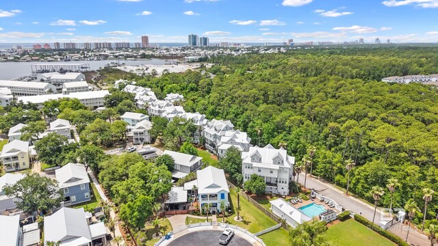 4672 Grander Ct Unit 15B, Orange Beach, AL 36561 - drone / aerial view of a view of skyline, a forest, and a pool area