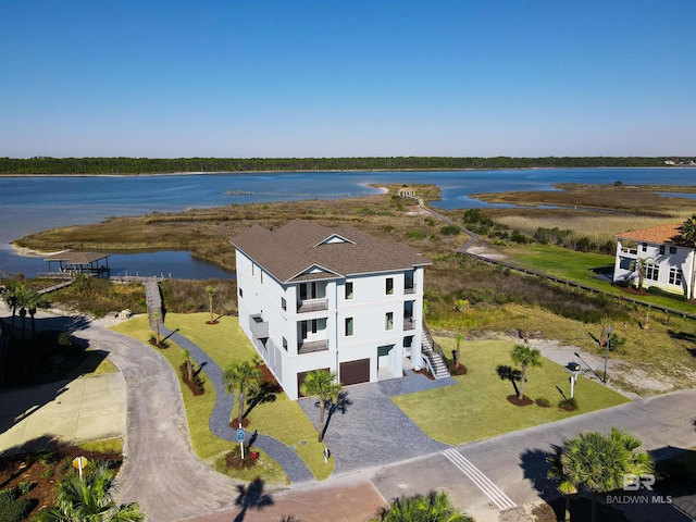 birds eye view of property with a water view