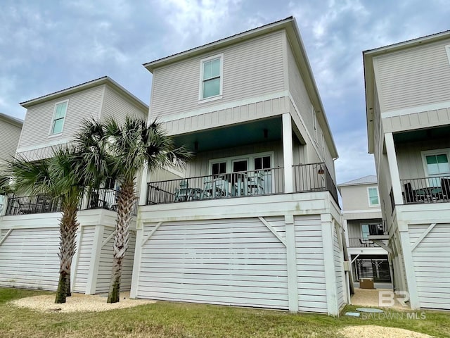 view of front of house featuring a balcony