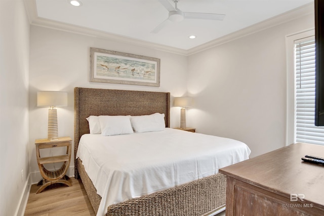 bedroom with ornamental molding, light wood finished floors, recessed lighting, baseboards, and ceiling fan