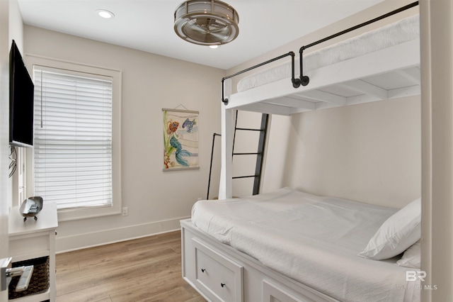 bedroom featuring light wood-style flooring, baseboards, and recessed lighting