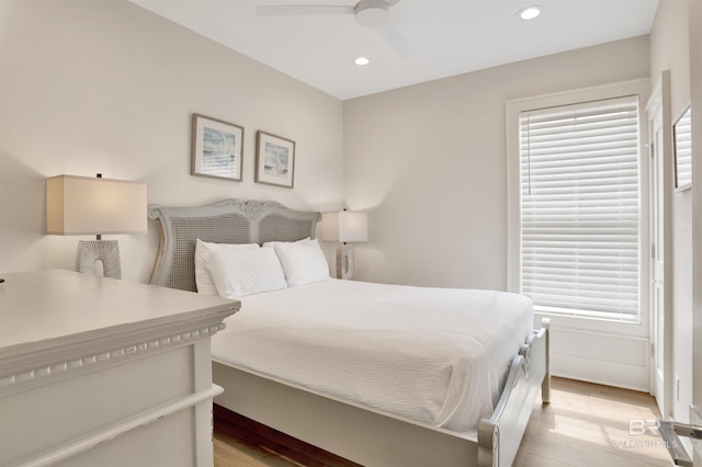 bedroom featuring light wood-type flooring, recessed lighting, a ceiling fan, and multiple windows