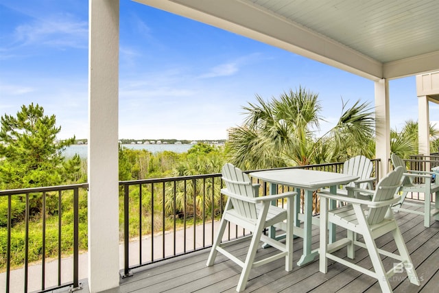 balcony featuring a water view