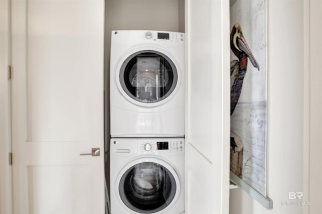 laundry area featuring stacked washer and clothes dryer