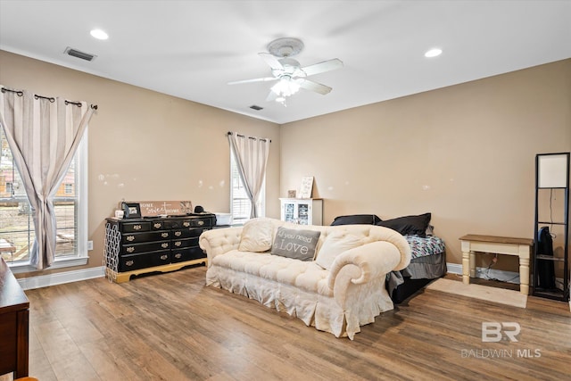 bedroom with hardwood / wood-style flooring and ceiling fan