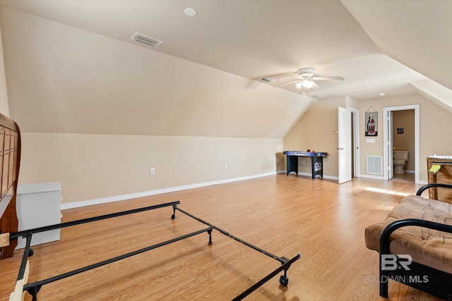 interior space featuring lofted ceiling, ceiling fan, and light hardwood / wood-style flooring