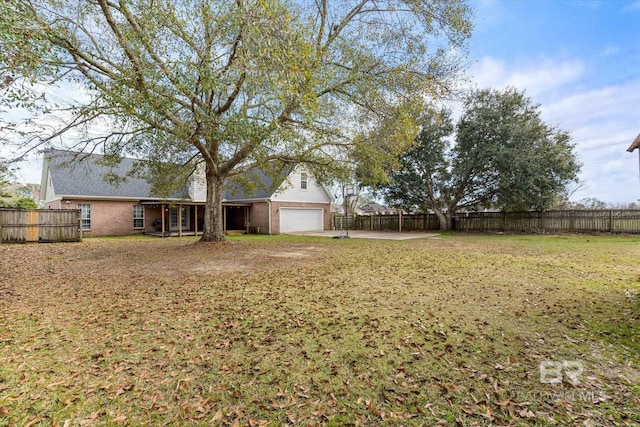 view of yard with a garage