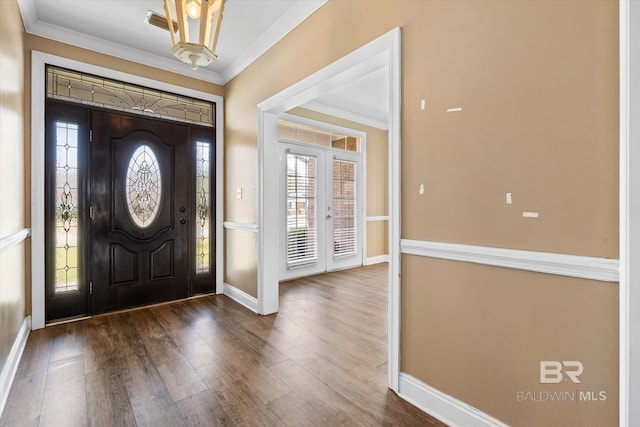 entryway featuring dark wood-type flooring, french doors, and crown molding