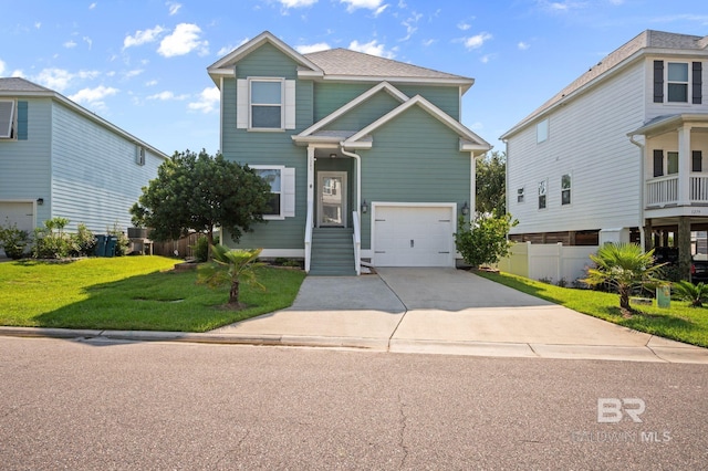 view of front of house with a front yard and a garage