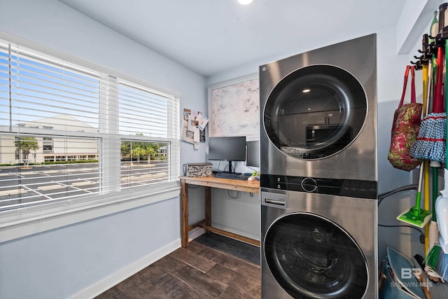 372 E Beach Blvd Unit 14, Gulf Shores, AL 36542 - washroom with stacked washer / dryer, dark wood-style flooring, baseboards, and a desk