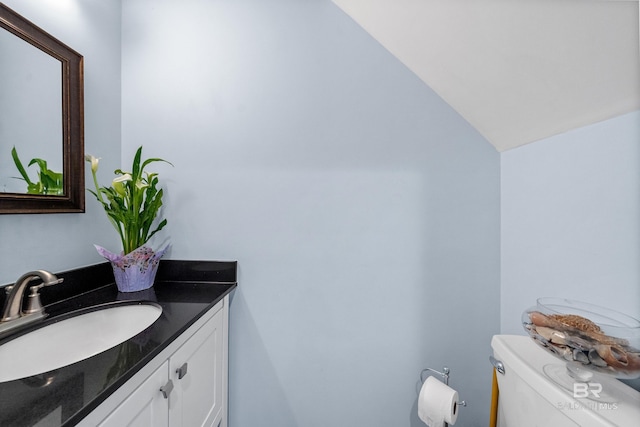 372 E Beach Blvd Unit 14, Gulf Shores, AL 36542 - half bath featuring vanity, toilet, and lofted ceiling